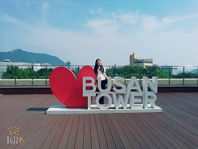 A person standing on a sign Description automatically generated with low confidence